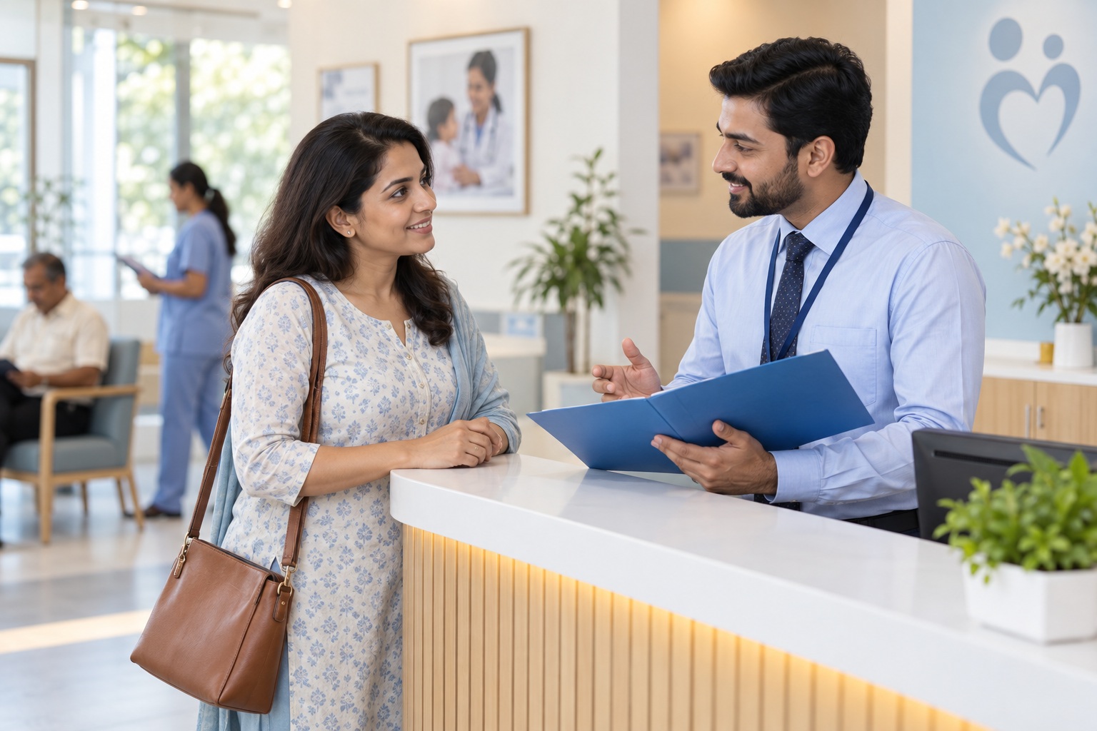Indian woman in her thirties speaking with a male advisor at a clean clinic reception counter holding a plain blue folder